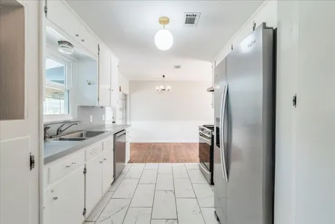 a bathroom with a sink and mirror