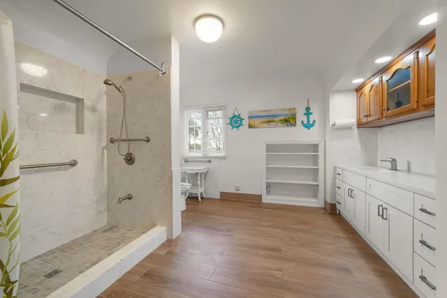 a bathroom with a bathtub and a shower