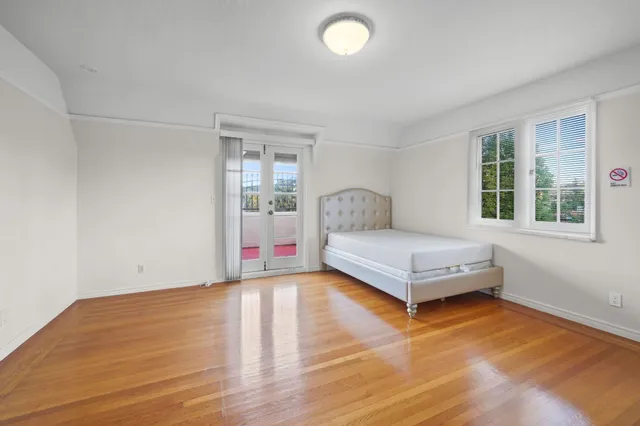 a bedroom with a bed and window