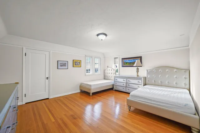 a bedroom with a large bed and a couch