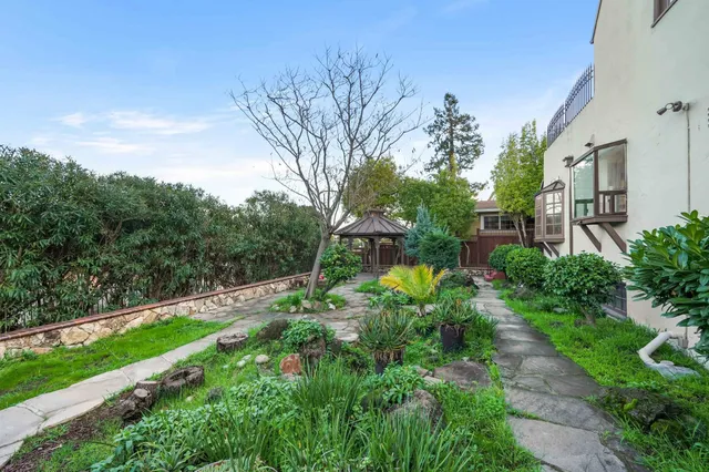 a backyard of a house with lots of green space