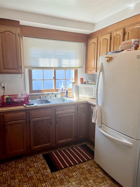 154 Ferncliff Road Rices Landing, PA 15357 - Photo 14 of 23 a kitchen with a refrigerator sink and cabinets