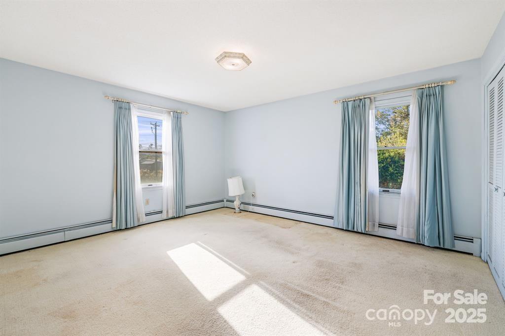 7 Brookshire Road Leicester, NC 28748 - Photo 16 of 40 a view of an empty room with a window