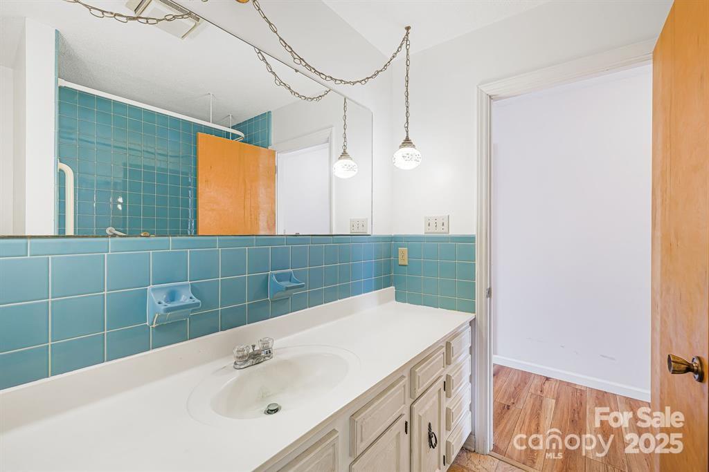 7 Brookshire Road Leicester, NC 28748 - Photo 18 of 40 a bathroom with a sink and a mirror