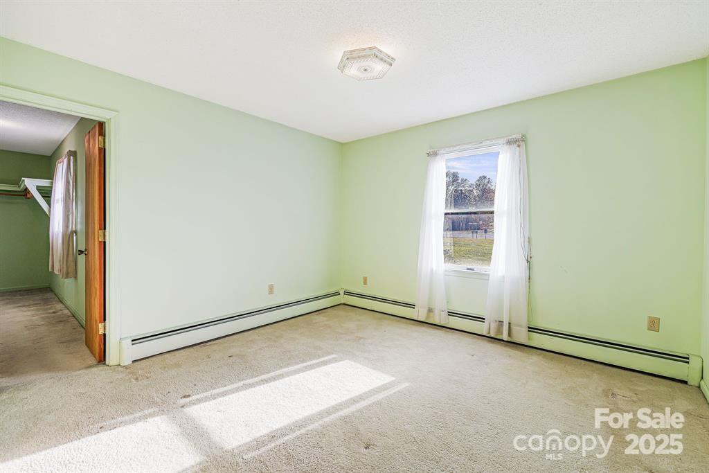 7 Brookshire Road Leicester, NC 28748 - Photo 20 of 40 an empty room with windows