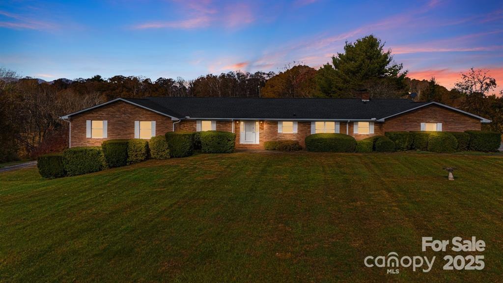7 Brookshire Road Leicester, NC 28748 - Photo 2 of 40 a front view of a house with a garden