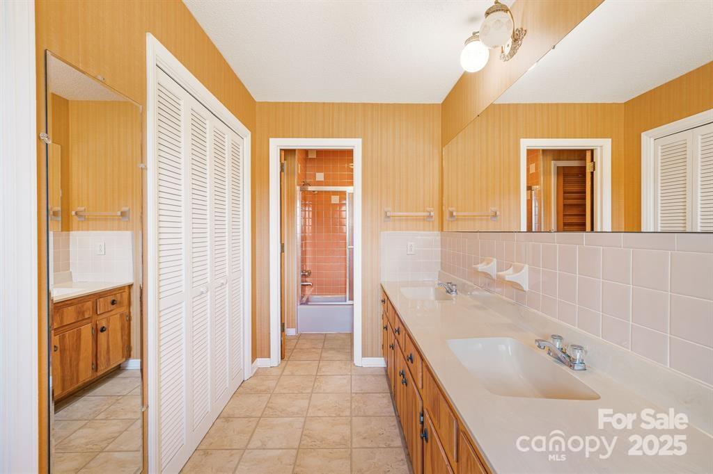 7 Brookshire Road Leicester, NC 28748 - Photo 24 of 40 a bathroom with a tub sink and mirror