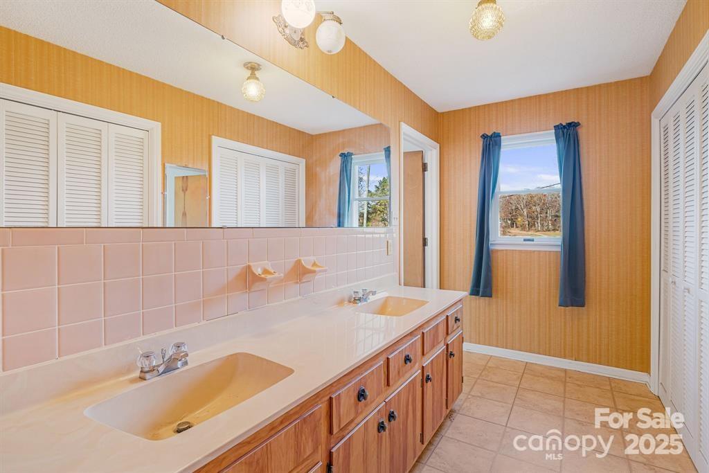 7 Brookshire Road Leicester, NC 28748 - Photo 25 of 40 a bathroom with a tub sink and mirror