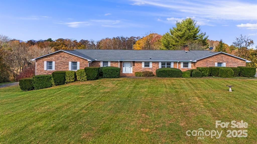 7 Brookshire Road Leicester, NC 28748 - Photo 34 of 40 a front view of a house with a yard