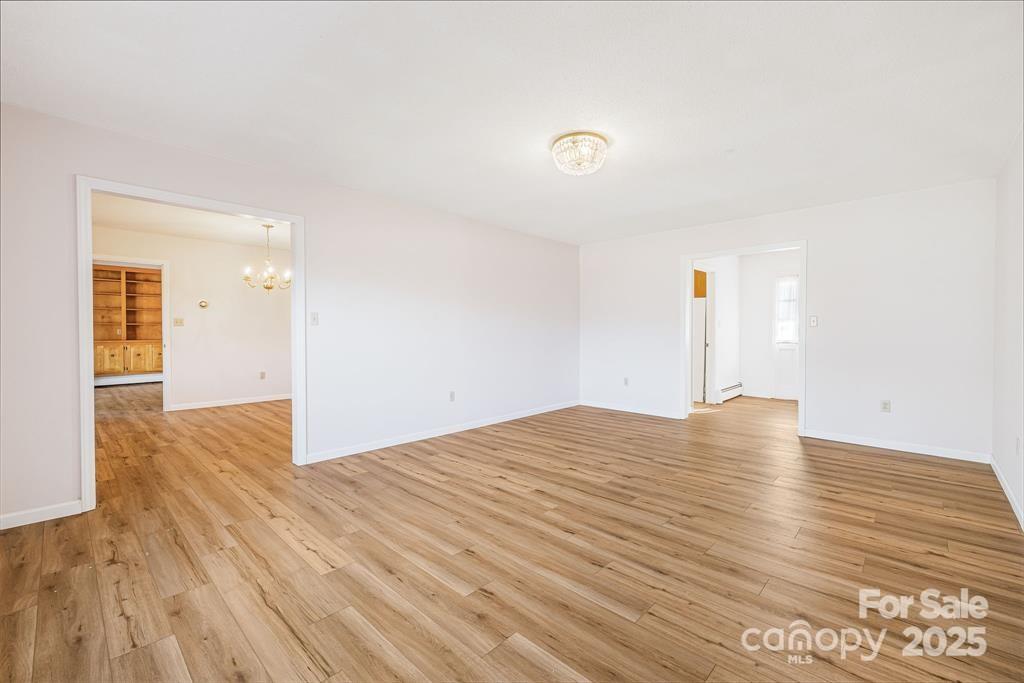 7 Brookshire Road Leicester, NC 28748 - Photo 8 of 40 a view of empty room with wooden floor