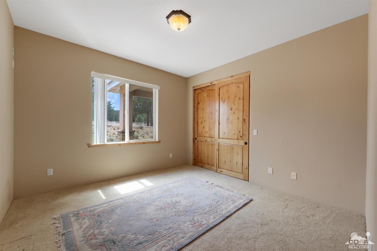 59870 Devils Ladder Road Mountain Center, CA 92561 - Photo 18 of 31 an empty room with windows