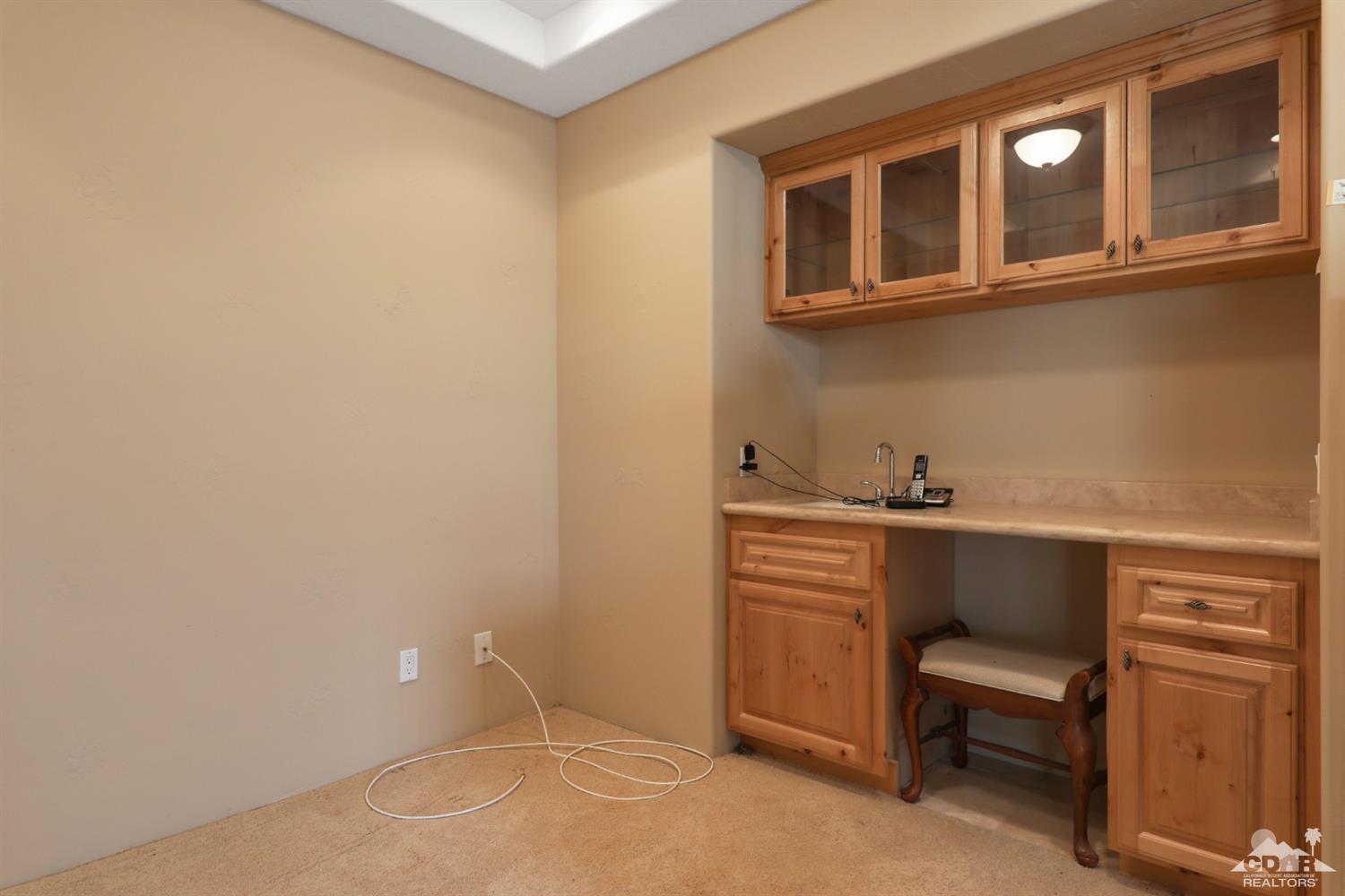 59870 Devils Ladder Road Mountain Center, CA 92561 - Photo 21 of 31 a hallway with a white cabinets