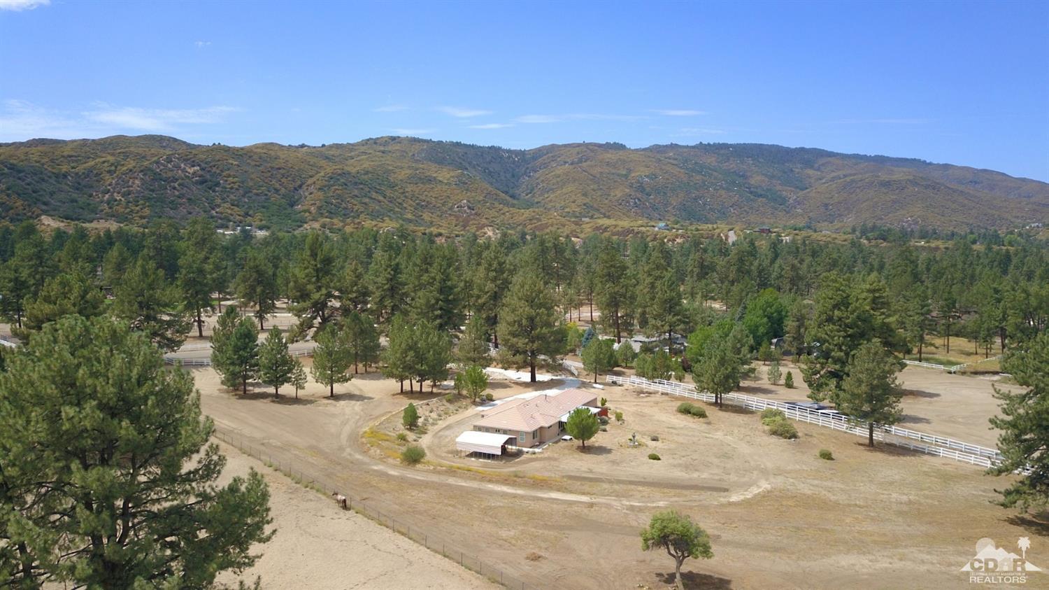 59870 Devils Ladder Road Mountain Center, CA 92561 - Photo 28 of 31 a view of a house with a mountain yard