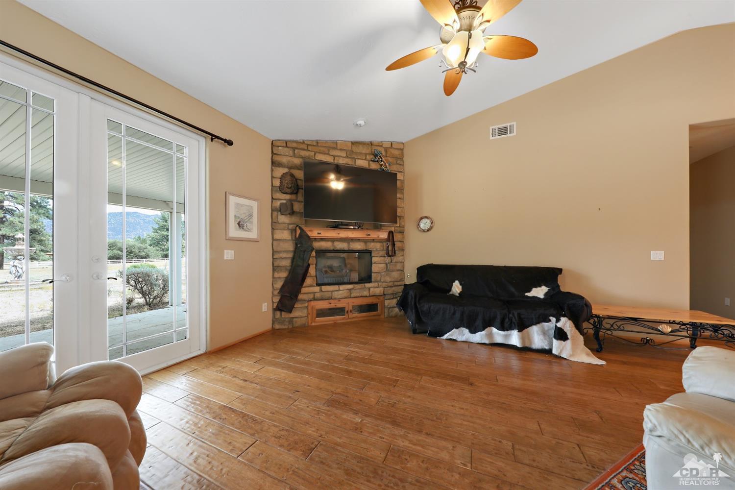 59870 Devils Ladder Road Mountain Center, CA 92561 - Photo 8 of 31 a bedroom with furniture and a large window