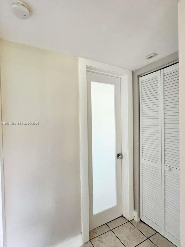 2651 Northwest 13th Street, Unit 41 Miami, FL 33125 - Photo 7 of 10 a view of a livingroom with wooden floor
