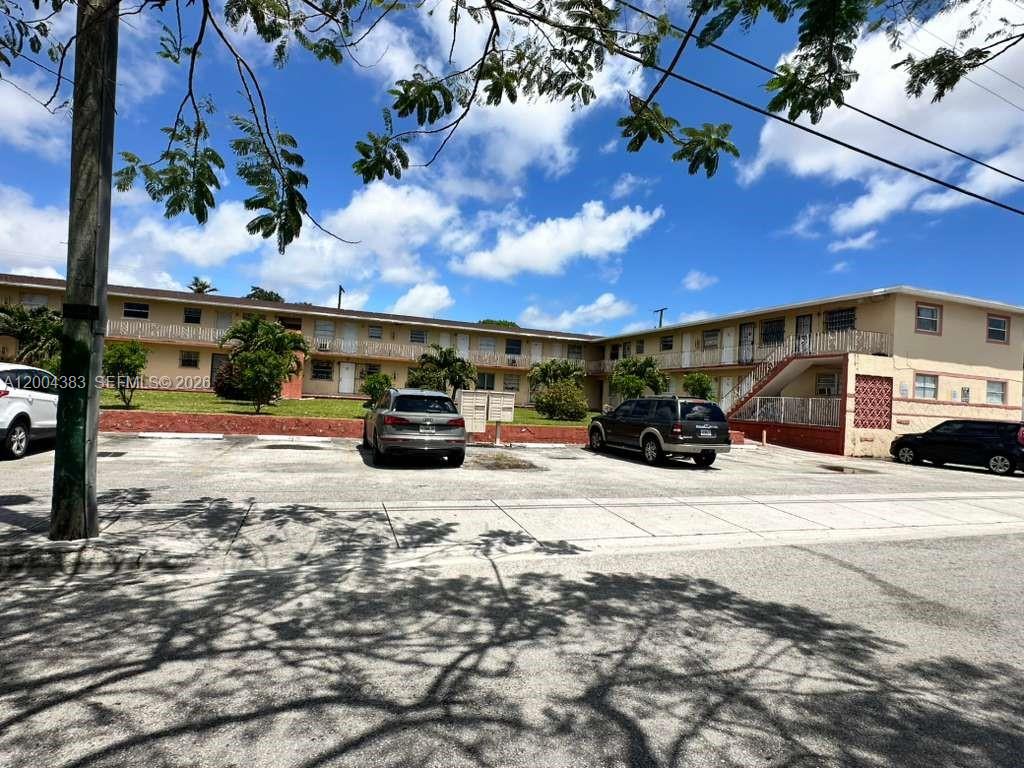 2651 Northwest 13th Street, Unit 41 Miami, FL 33125 - Photo 10 of 10 a view of street with parked cars