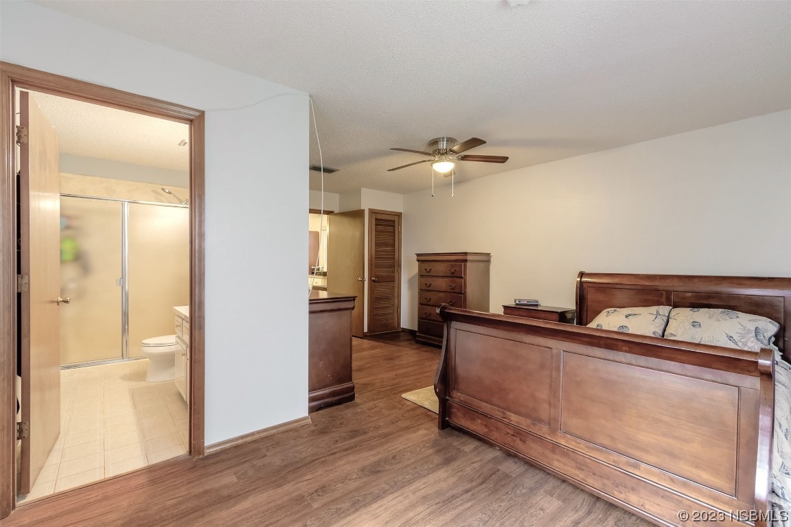 2804 Mango Tree Drive Edgewater, FL 32141 - Photo 12 of 29 a view of a kitchen with furniture and wooden floor