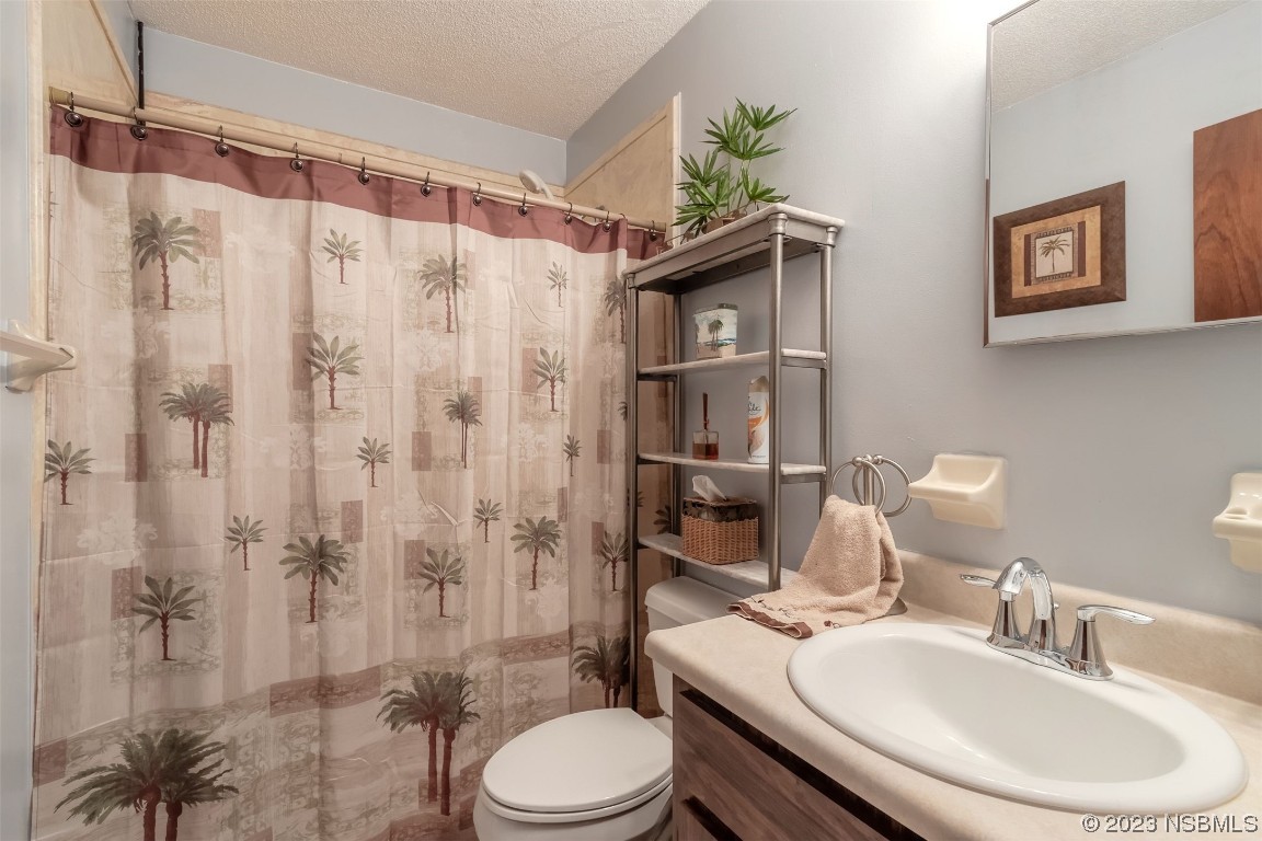 2804 Mango Tree Drive Edgewater, FL 32141 - Photo 17 of 29 a bathroom with a sink toilet and shower