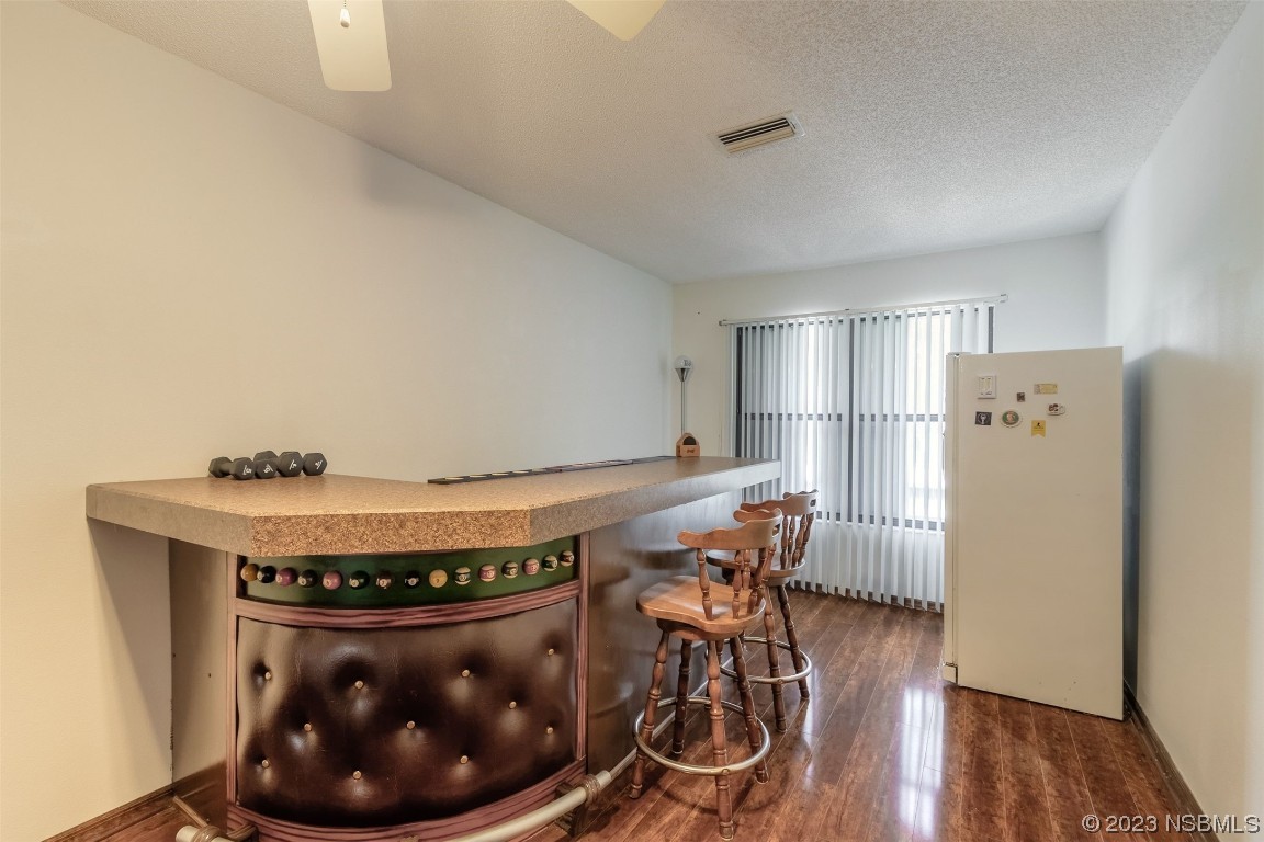 2804 Mango Tree Drive Edgewater, FL 32141 - Photo 20 of 29 a room with wooden furniture and wooden floors