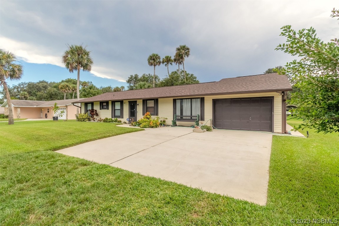 2804 Mango Tree Drive Edgewater, FL 32141 - Photo 2 of 29 a front view of house with yard