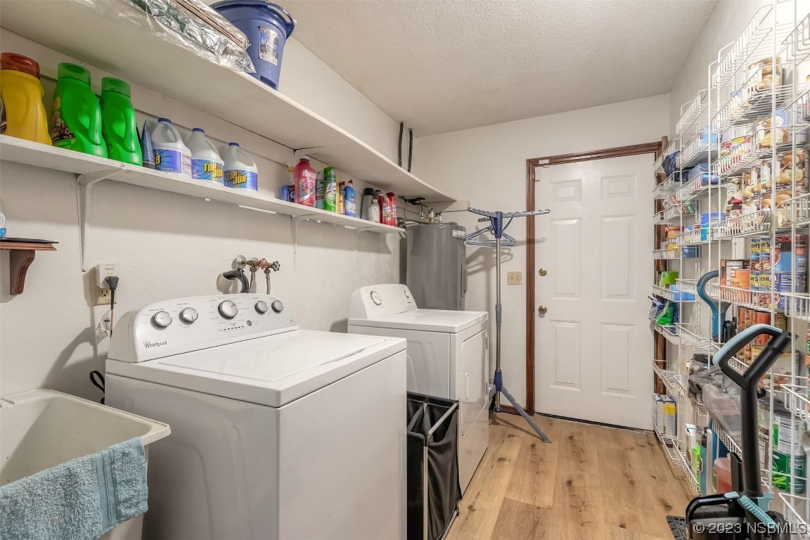 2804 Mango Tree Drive Edgewater, FL 32141 - Photo 22 of 29 a utility room with dryer and washer