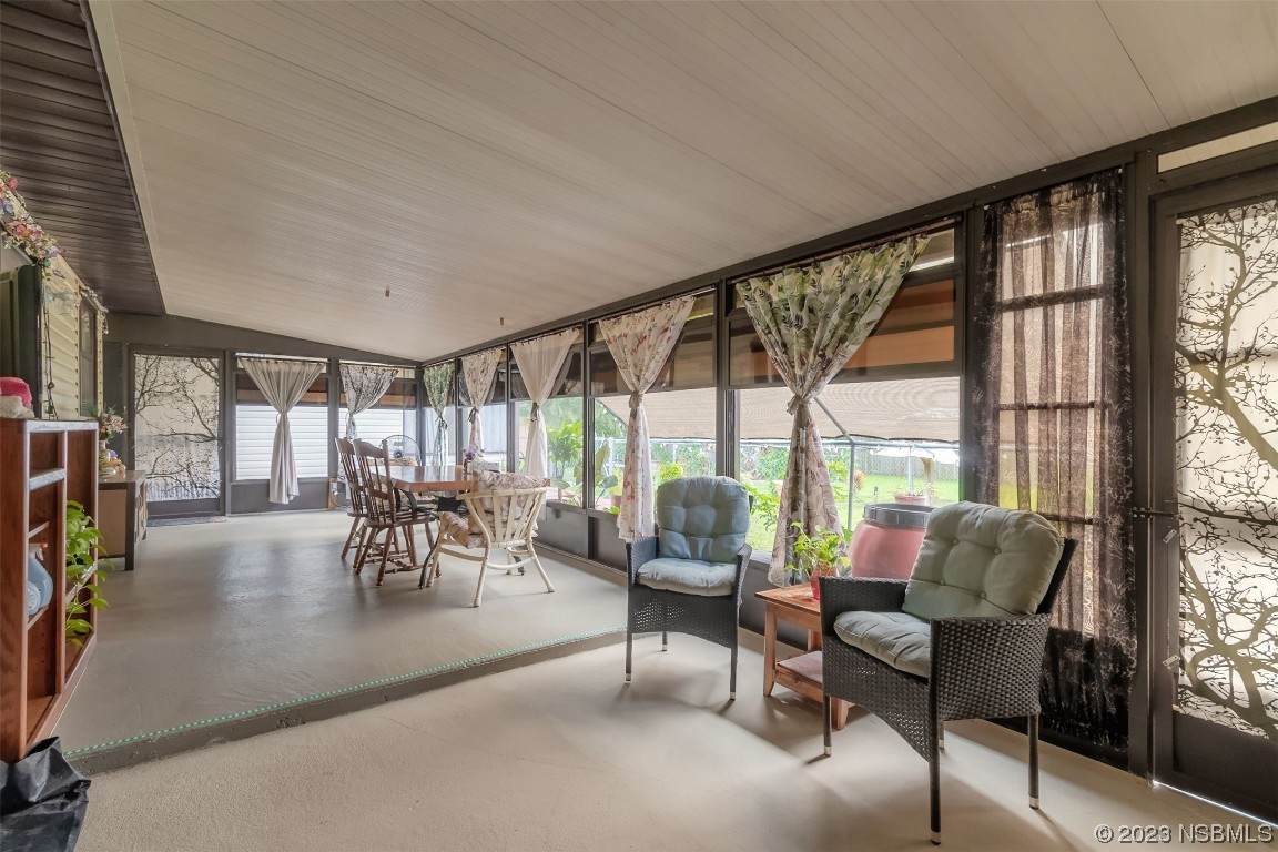 2804 Mango Tree Drive Edgewater, FL 32141 - Photo 24 of 29 a living room with furniture and a large window
