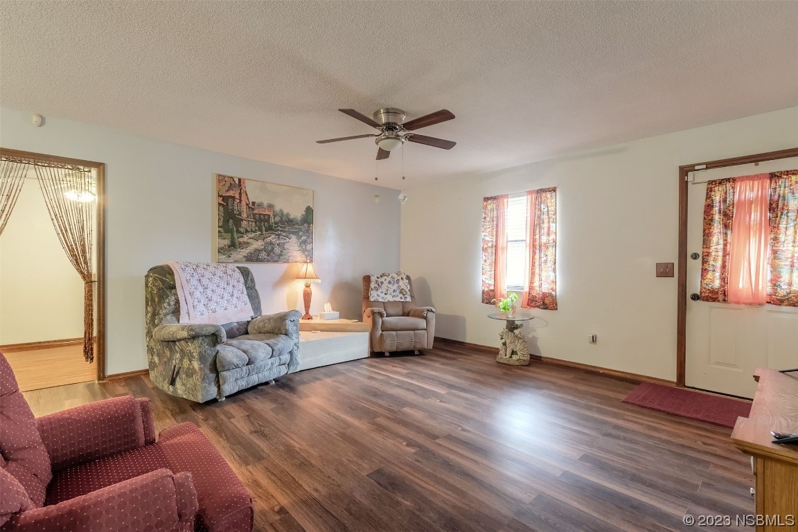2804 Mango Tree Drive Edgewater, FL 32141 - Photo 4 of 29 a living room with furniture and a window