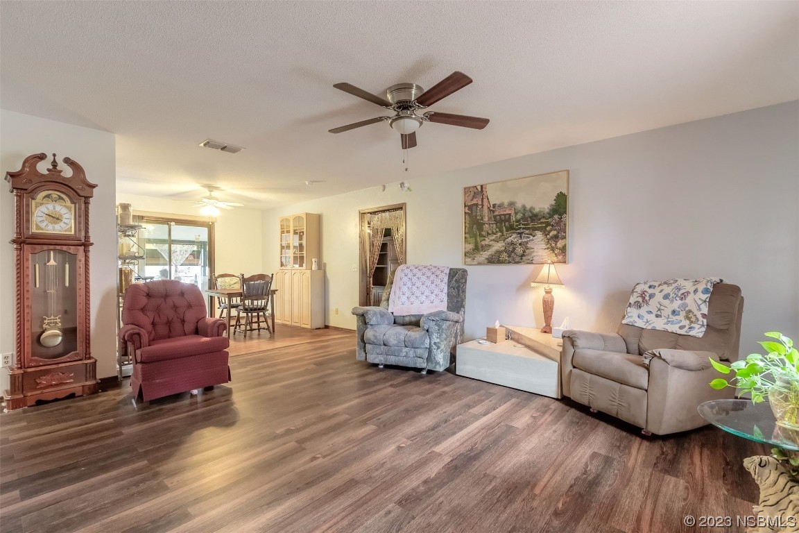 2804 Mango Tree Drive Edgewater, FL 32141 - Photo 5 of 29 a living room with furniture and a wooden floor