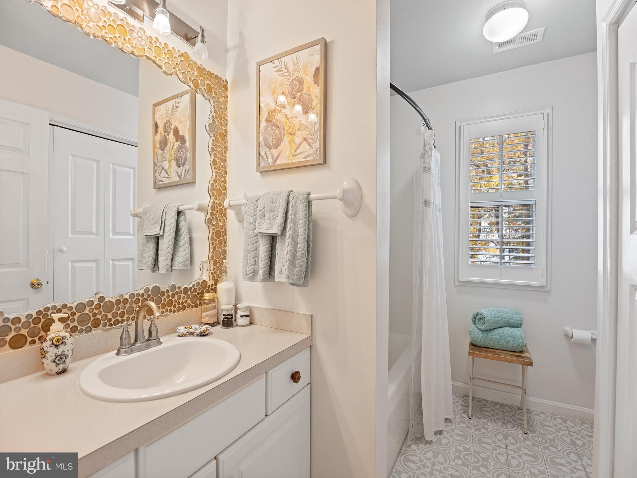 12964 Pine Place Lusby, MD 20657 - Photo 41 of 63 Upstairs full hall bath with laundry closet.