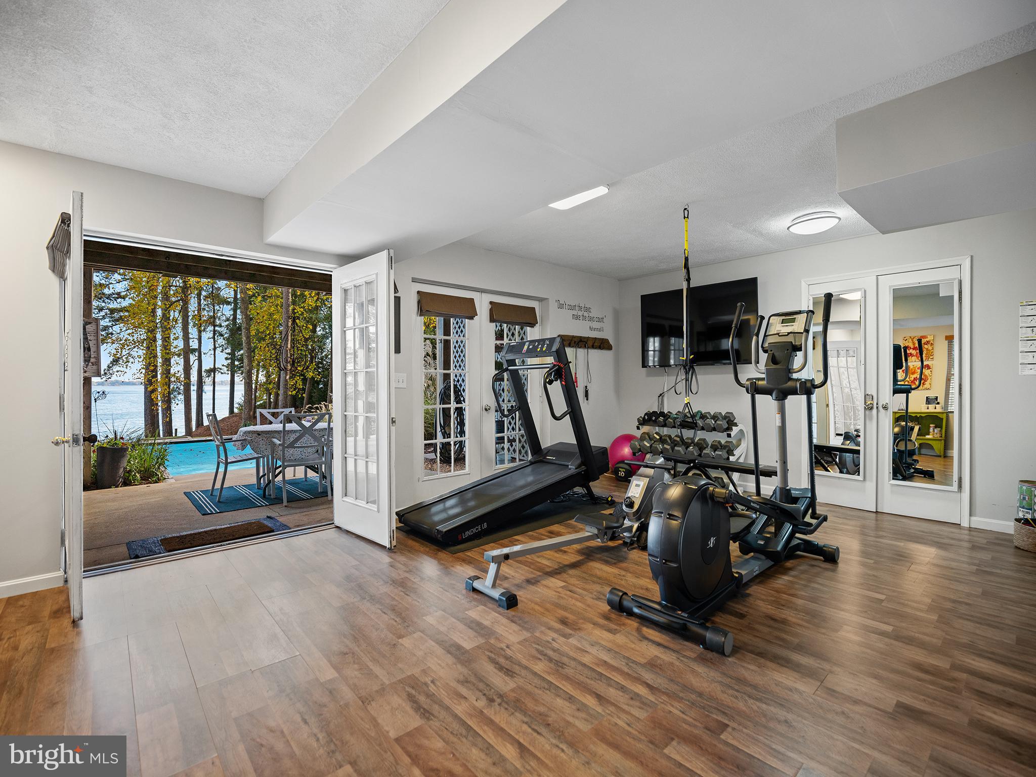 12964 Pine Place Lusby, MD 20657 - Photo 49 of 63 Walkout to patio, pool, firepit and beach.