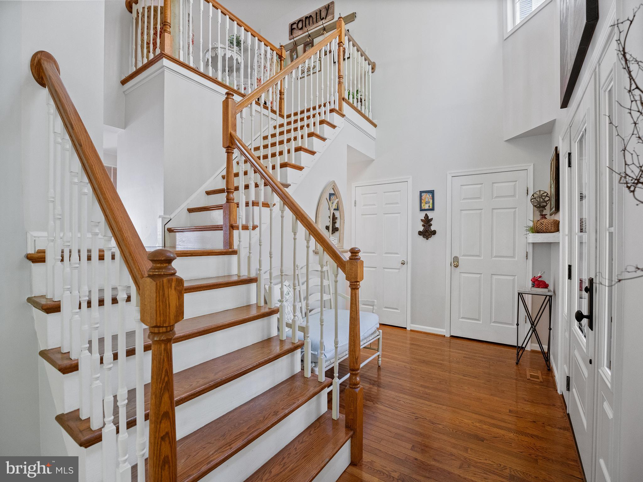 12964 Pine Place Lusby, MD 20657 - Photo 7 of 63 Hardwood floors upon entry and on staircase.