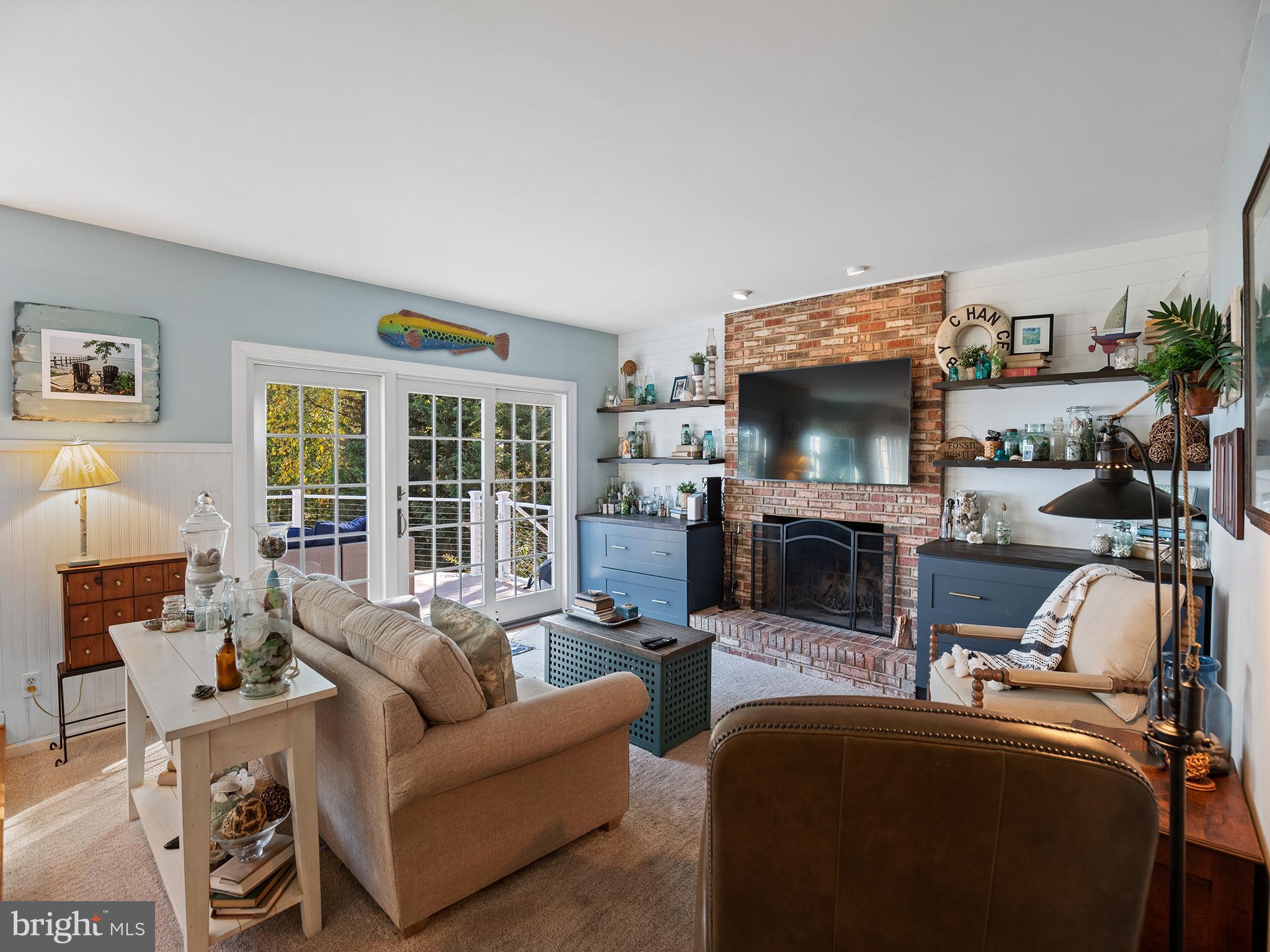 12964 Pine Place Lusby, MD 20657 - Photo 9 of 63 Bay side living room with fireplace & deck access.