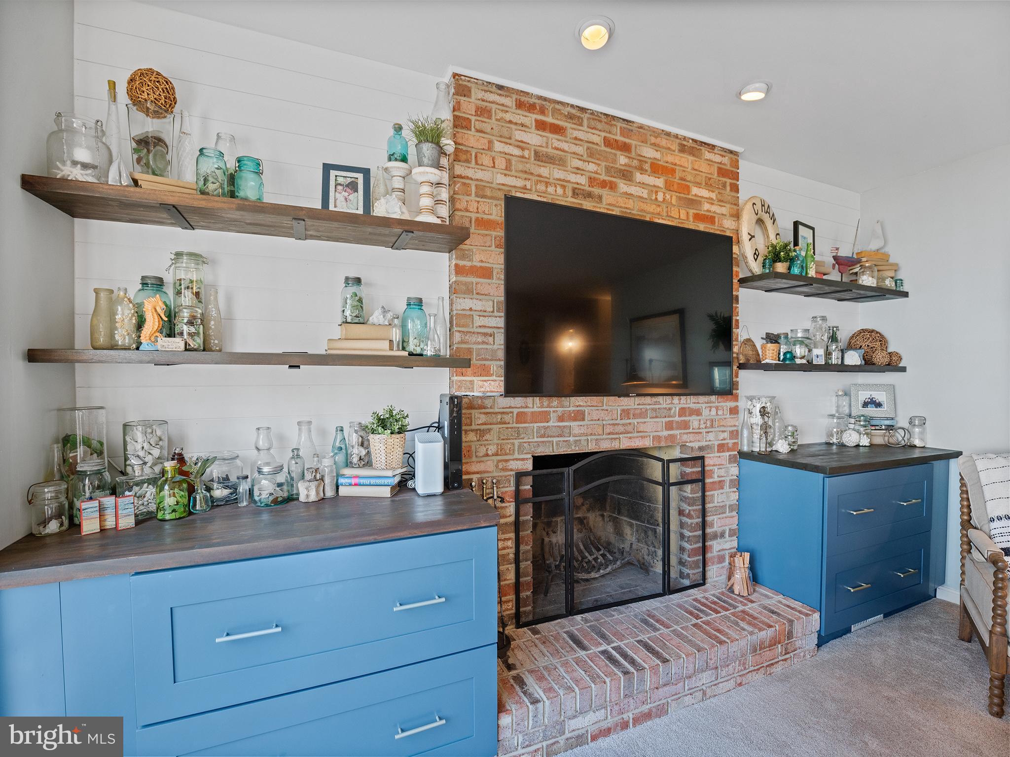 12964 Pine Place Lusby, MD 20657 - Photo 10 of 63 Custom built-ins around fireplace.