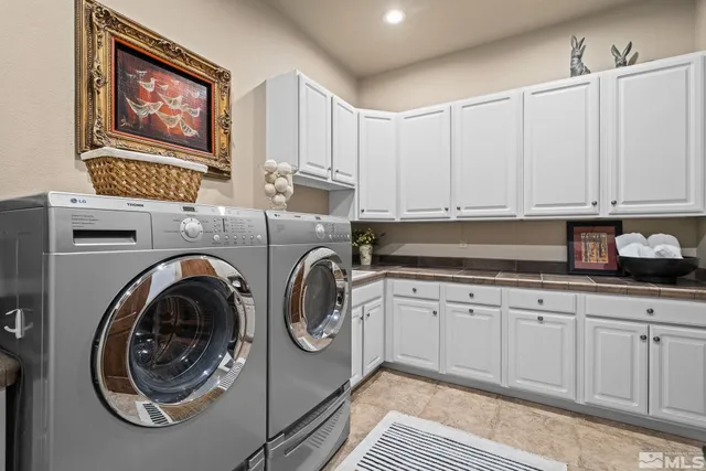 a kitchen with stainless steel appliances granite countertop a sink and cabinets