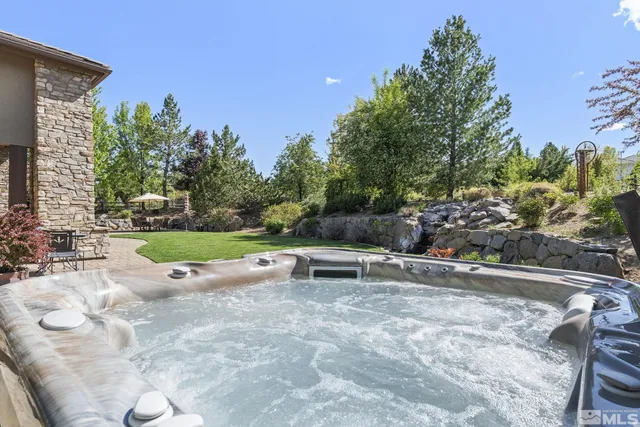 a view of a swimming pool with a patio