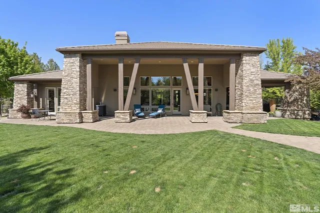 a view of a house with small yard and plants