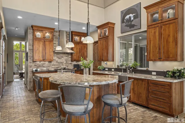 a kitchen with a table chairs stove and cabinets