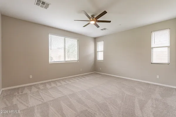 a view of an empty room and a window