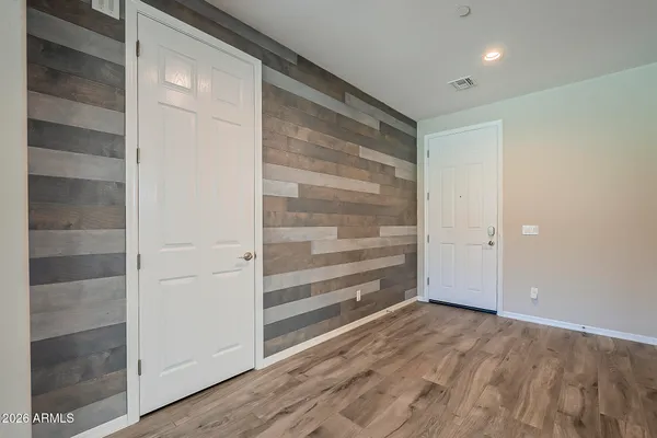 a view of an empty room with a fan