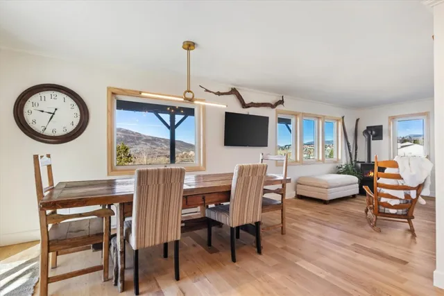 a view of a livingroom with furniture window and wooden floor