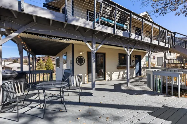 a view of a chairs and table in the patio