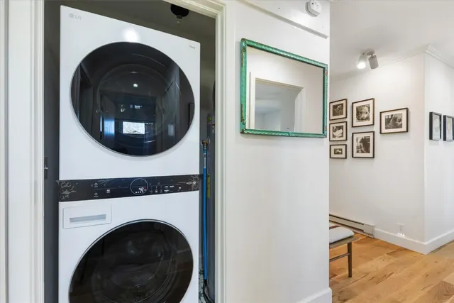 a view of a hallway with washer and dryer