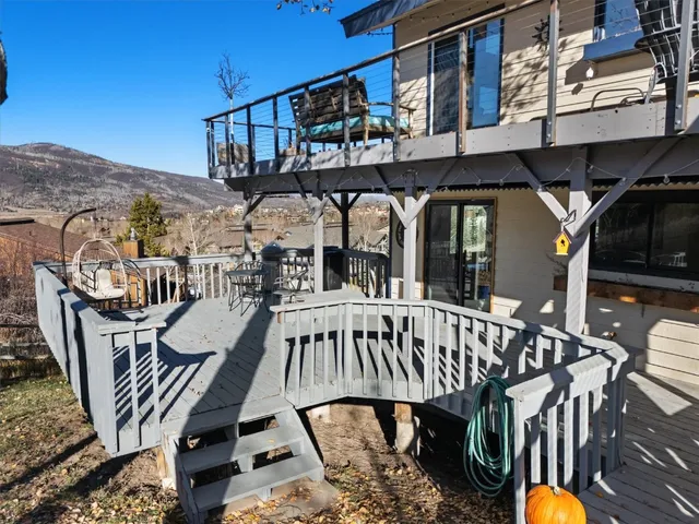 a view of a balcony with chairs
