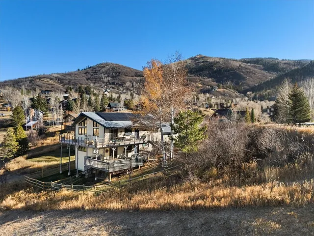 a view of a town with mountains in the background