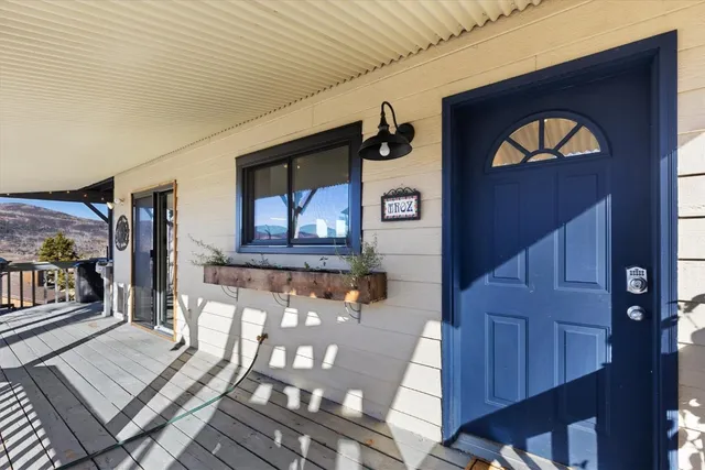 a view of a living room and wooden floor
