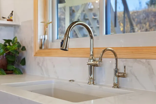 a bathroom with a sink and a faucet