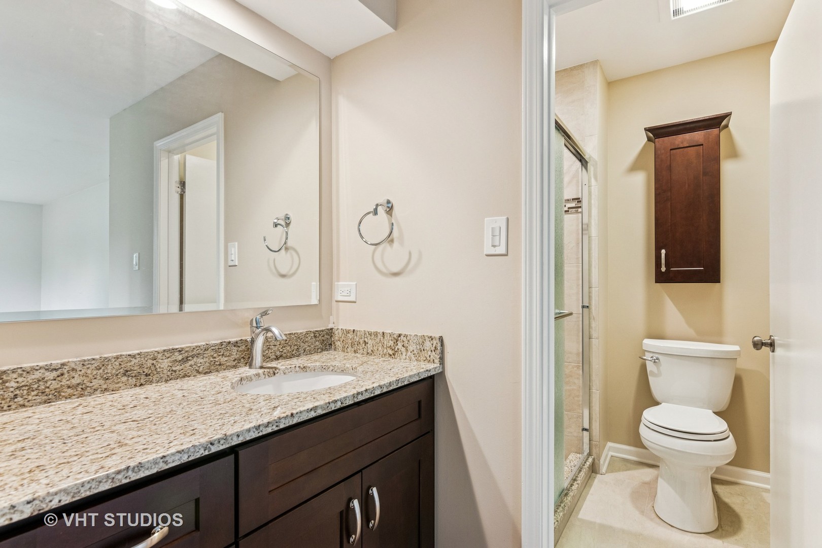 1490 Briar Cove Wheaton, IL 60189 - Photo 14 of 22 a bathroom with a granite countertop sink toilet and shower