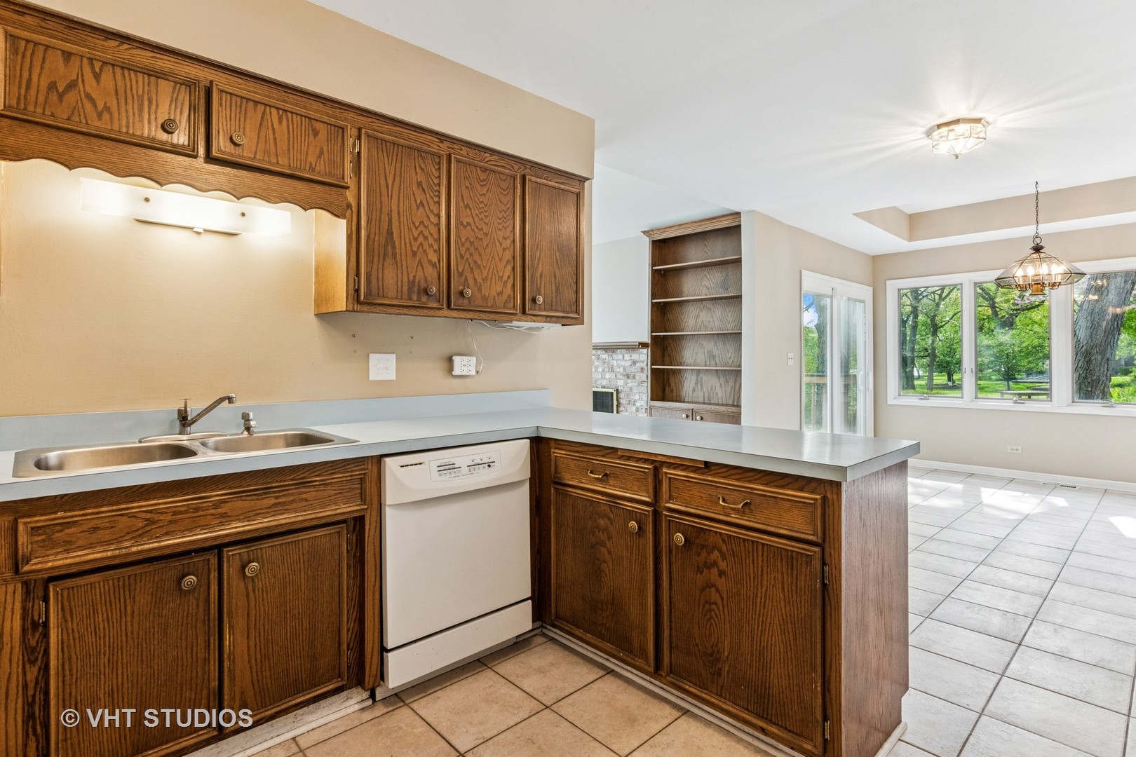 1490 Briar Cove Wheaton, IL 60189 - Photo 8 of 22 a kitchen with a sink cabinets and window