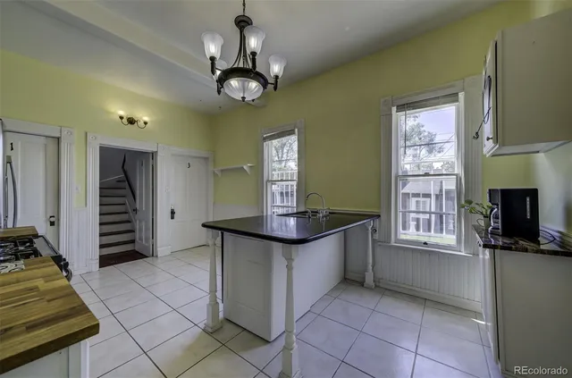 a kitchen with stainless steel appliances granite countertop a stove and a refrigerator