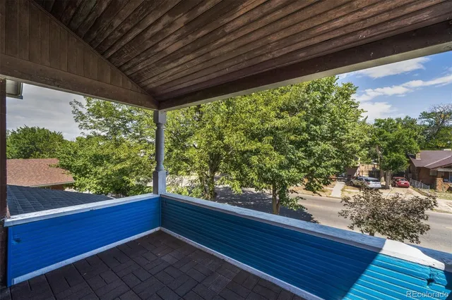 a view of balcony with wooden floor